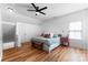 Bright bedroom features wood floors, ceiling fan and window at 7850 Bud Henderson Rd, Huntersville, NC 28078
