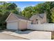 Charming exterior view of the home with a spacious garage and well-maintained yard at 7850 Bud Henderson Rd, Huntersville, NC 28078