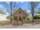 Charming home featuring a picket fence, well-maintained yard, and inviting entrance with stone accents at 7850 Bud Henderson Rd, Huntersville, NC 28078