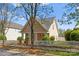 Charming home featuring a picket fence, well-maintained yard, and inviting entrance with stone accents at 7850 Bud Henderson Rd, Huntersville, NC 28078