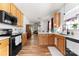 Bright kitchen featuring oak cabinets, ample counter space, and a functional layout at 7850 Bud Henderson Rd, Huntersville, NC 28078