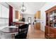 Bright kitchen and dining area featuring oak cabinets, ample counter space, and a functional layout at 7850 Bud Henderson Rd, Huntersville, NC 28078