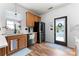 Well-lit kitchen featuring oak cabinets and modern appliances, with a view to the backyard at 7850 Bud Henderson Rd, Huntersville, NC 28078
