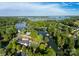 Expansive aerial view of a lake community with homes nestled among lush greenery and waterfront access at 7851 Green Cove Ct, Denver, NC 28037