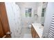 Well-lit bathroom with vanity, shower-tub combo, and ample storage at 7851 Green Cove Ct, Denver, NC 28037