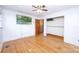 Comfortable bedroom with hardwood floors, closet, and natural light at 7851 Green Cove Ct, Denver, NC 28037