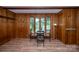 Bright dining area featuring wood paneling, new floors and views of the lake at 7851 Green Cove Ct, Denver, NC 28037