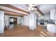 Inviting living area featuring wood beams, white walls, hardwood floors, and an adjoining kitchen at 7851 Green Cove Ct, Denver, NC 28037