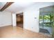 Bright living room with an exterior door leading to a screened-in porch with water views at 7851 Green Cove Ct, Denver, NC 28037