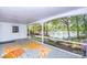 Spacious screened-in porch boasting scenic views of the lake at 7851 Green Cove Ct, Denver, NC 28037