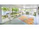 Screened-in porch with water views and a patterned rug at 7851 Green Cove Ct, Denver, NC 28037
