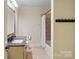 Bathroom featuring a tub with shower and granite vanity at 8086 Summit Ridge Dr, Catawba, NC 28609