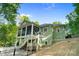 Back exterior of the house showing the screened in back porch and access to the backyard at 8086 Summit Ridge Dr, Catawba, NC 28609