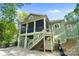 Back exterior of the house showing the screened in back porch and access to the backyard at 8086 Summit Ridge Dr, Catawba, NC 28609