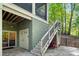 Exterior view of backyard featuring sliding doors and staircase to screened porch at 8086 Summit Ridge Dr, Catawba, NC 28609