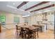 Eat-in kitchen offers a breakfast bar, dining table, wood beams and adjoins the main living area at 8086 Summit Ridge Dr, Catawba, NC 28609