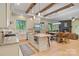 Open kitchen featuring a farmhouse sink, kitchen island, and views into the living room at 8086 Summit Ridge Dr, Catawba, NC 28609