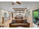 Open concept living room featuring wood beams, an eat-in kitchen, and views to an outdoor patio at 8086 Summit Ridge Dr, Catawba, NC 28609