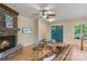 Comfortable living room featuring a stone fireplace, wood floors, and stylish furnishings at 8086 Summit Ridge Dr, Catawba, NC 28609