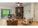 Inviting living room with stone fireplace, comfortable seating, and sliding doors to the outdoors at 8086 Summit Ridge Dr, Catawba, NC 28609