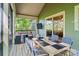 Covered back porch features a dining set and views of the outdoor living spaces at 8086 Summit Ridge Dr, Catawba, NC 28609