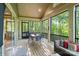 Covered back patio complete with dining set and cozy furniture for entertaining at 8086 Summit Ridge Dr, Catawba, NC 28609
