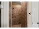 Walk-in shower with ceramic tiles and neutral color scheme at 8086 Summit Ridge Dr, Catawba, NC 28609
