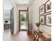 Welcoming foyer featuring hardwood floors, neutral paint, and a view of the landscaped front yard at 8708 Soaring Eagle Ln, Waxhaw, NC 28173