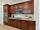 This kitchen has wood cabinetry, stainless steel appliances, and granite countertops at 8708 Soaring Eagle Ln, Waxhaw, NC 28173