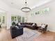 This spacious living room is well lit and features a large sectional couch and neutral colored walls at 8708 Soaring Eagle Ln, Waxhaw, NC 28173