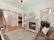 Cozy living room showcasing fireplace, neutral decor, and open floor plan at 8708 Soaring Eagle Ln, Waxhaw, NC 28173
