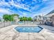 View of the hot tub and pool area with the slide and seating areas in the background at 8708 Soaring Eagle Ln, Waxhaw, NC 28173