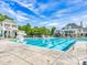 A beautiful community pool featuring a slide and a spacious deck for relaxing and enjoying the summer weather at 8708 Soaring Eagle Ln, Waxhaw, NC 28173