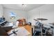 Music room features hardwood floors, ample sunlight, and an electric drum set with guitars at 901 Central Dr, Kannapolis, NC 28083