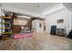 Spacious room with brick accents, string lighting, and endless possibilities for customization at 901 Central Dr, Kannapolis, NC 28083