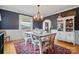 Elegant dining room with a large table, stylish chairs, and natural light from the window at 901 Central Dr, Kannapolis, NC 28083