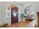 Elegant front foyer with hardwood floors, decorative door, and welcoming ambiance at 901 Central Dr, Kannapolis, NC 28083