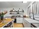 Charming kitchen with open shelving, white cabinets, butcher block counters and stainless steel appliances at 901 Central Dr, Kannapolis, NC 28083