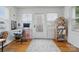 Bright home office featuring a large window, hardwood floors, and a cozy workspace at 901 Central Dr, Kannapolis, NC 28083