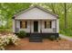 Charming home with a cozy front porch, black shutters, and a well-manicured yard at 905 Gantt St, Kings Mountain, NC 28086