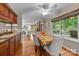 Cozy dining area with views of the outdoor deck and a glimpse into the living room at 9310 Hunting Ct, Matthews, NC 28105