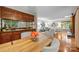 Stylish dining area with a view of the living room and a mirrored bar area at 9310 Hunting Ct, Matthews, NC 28105