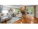 Inviting living room featuring a fireplace, hardwood floors, and access to outdoor space at 9310 Hunting Ct, Matthews, NC 28105