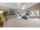Bright main bedroom featuring a ceiling fan, large windows, and ample space for relaxation at 9310 Hunting Ct, Matthews, NC 28105