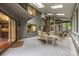 Spacious sunroom featuring skylights, ceiling fans, and an outdoor view of the backyard at 9310 Hunting Ct, Matthews, NC 28105