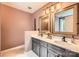 Bathroom boasts double sinks, modern fixtures, and vanity lighting above each mirror at 9517 Harris Glen Dr, Charlotte, NC 28269