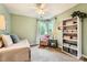 Comfortable bedroom with daybed, chair, bookshelf and natural light from the windows at 9517 Harris Glen Dr, Charlotte, NC 28269