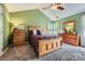 Bright bedroom with carpet flooring, a ceiling fan, and natural light from large windows at 9517 Harris Glen Dr, Charlotte, NC 28269