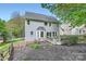 Two-story home with a spacious backyard, wooden fence and deck at 9517 Harris Glen Dr, Charlotte, NC 28269