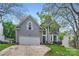 Charming home featuring an attached two-car garage, well-manicured lawn, and beautiful curb appeal at 9517 Harris Glen Dr, Charlotte, NC 28269